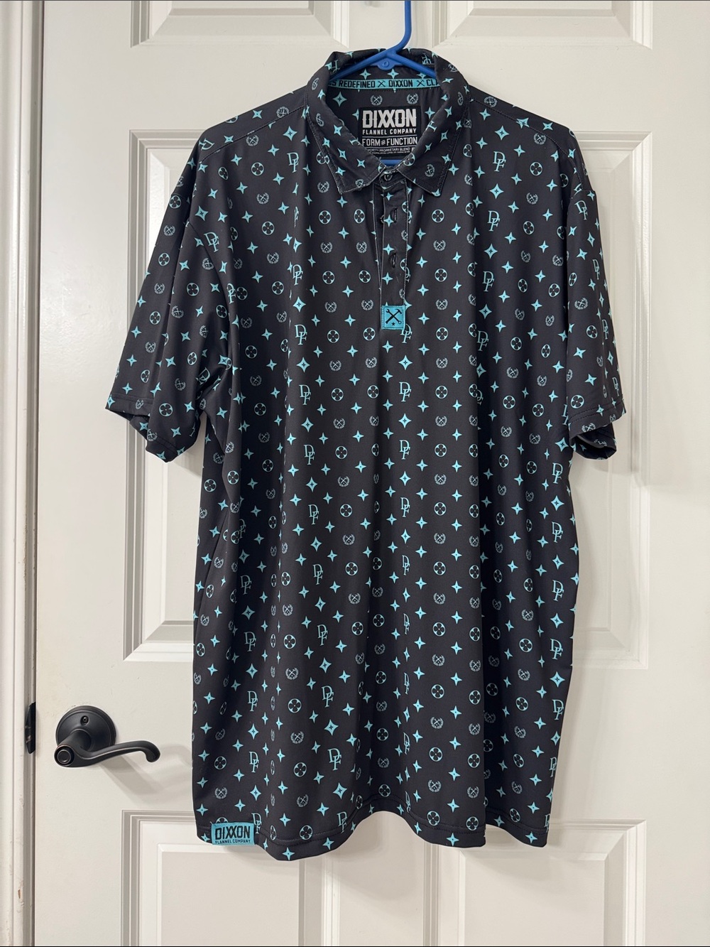DIXXON Black Polo with Teal Motif Print